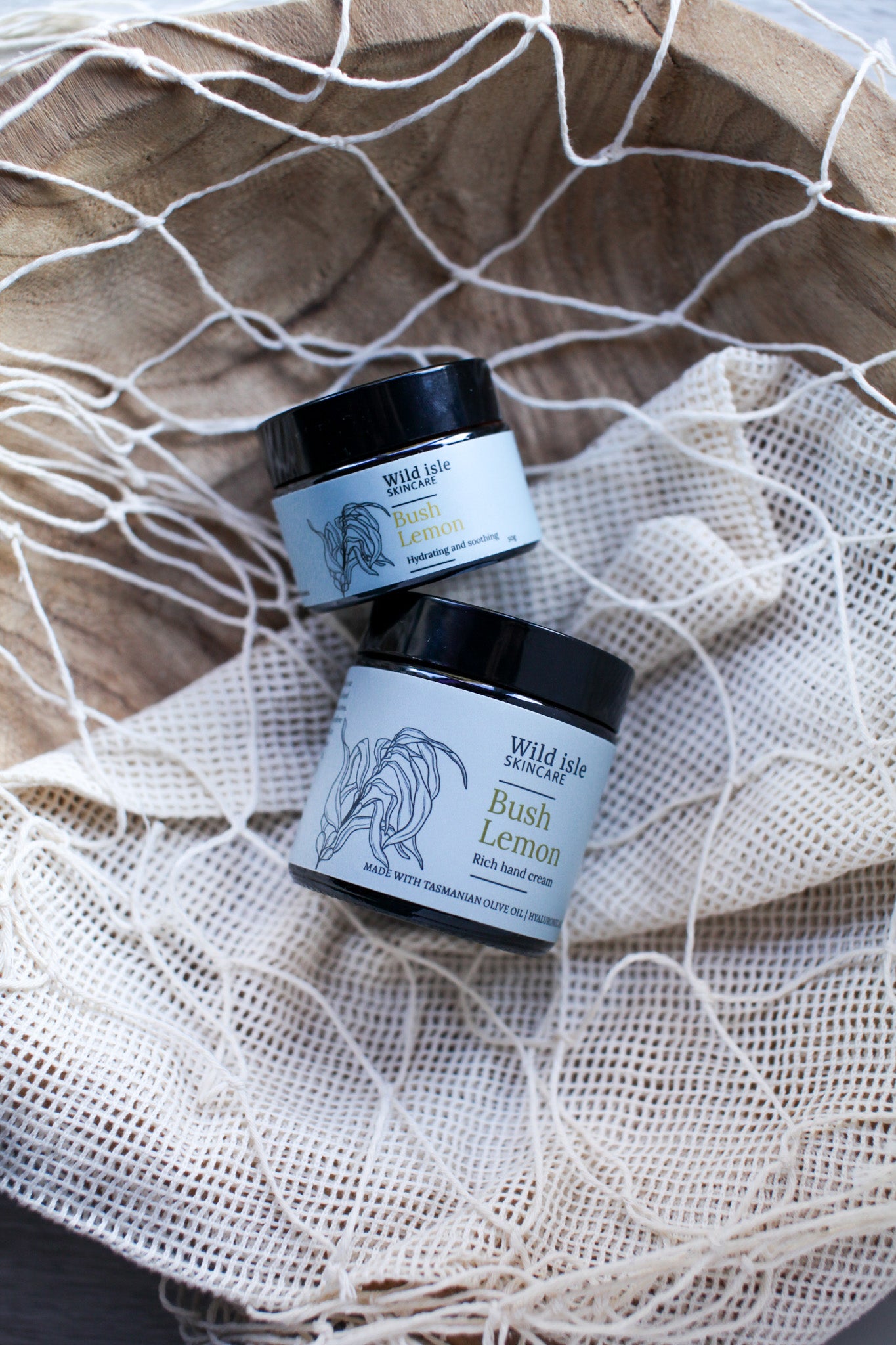 Two jars of Wild Life Skincare on a bush lemon tasmanian made