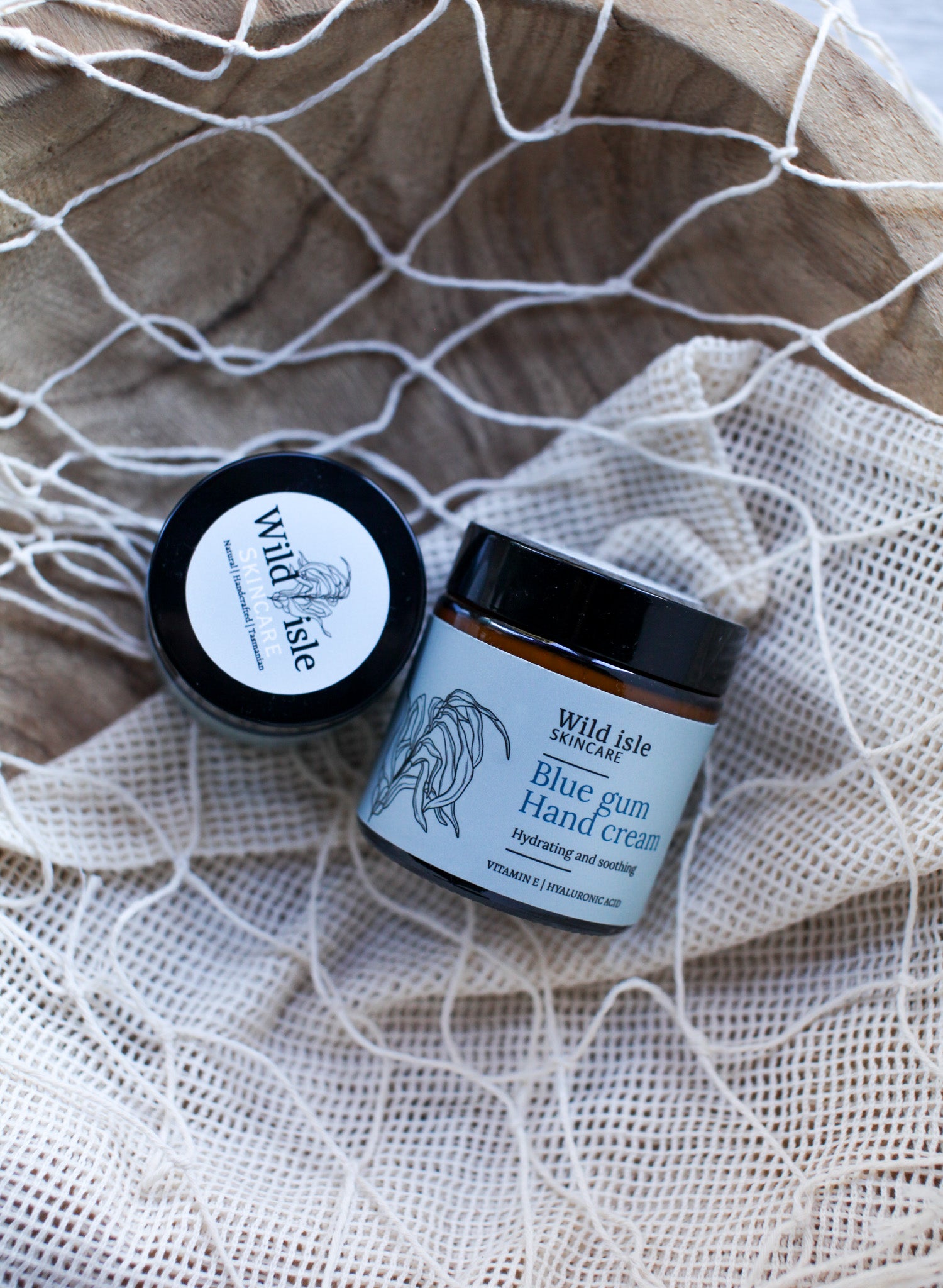 Two jars of Wild Isle Skincare cream blue gum scent