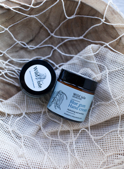 Two jars of Wild Isle Skincare cream blue gum scent